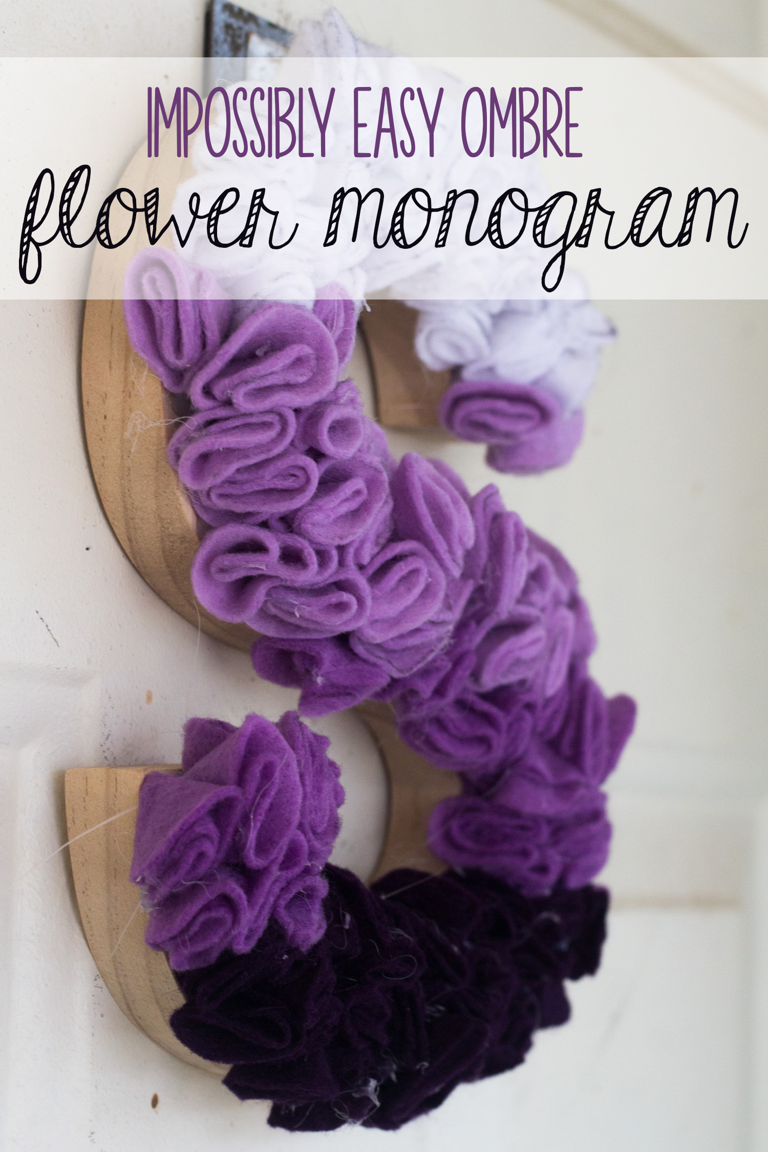 If you’re looking for the perfect door hanging or office decor, you’re going to love this impossibly easy ombre flower monogram! If you can trace a circle, fold a piece of felt, and use a hot glue gun, you can make this! It is the perfect substitute for a DIY Wreath, or looks great on any wall! Just pick the letter or wooden shape that appeals to you, and you’re all set to make this fun creation!