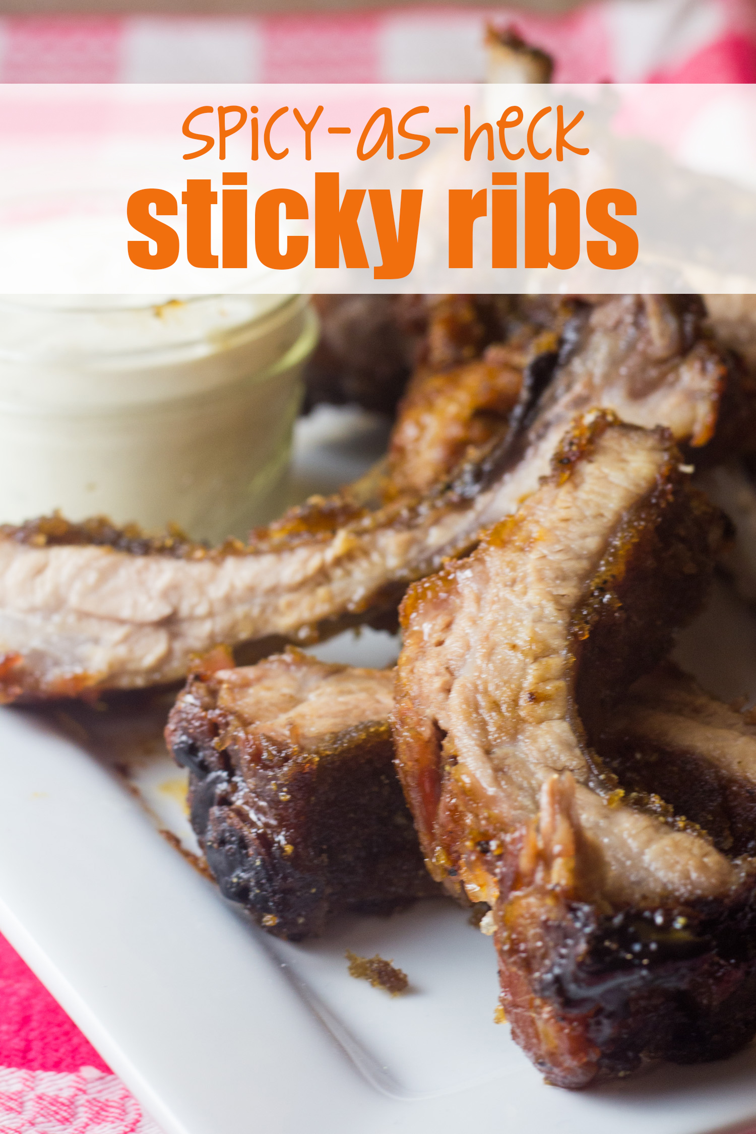 Do you like it hot? These spicy-as-heck sticky ribs are for you, then! A little bit sweet, a lot spicy, and oh-so-finger-licking delicious…. Use your favorite hot sauce to really kick up the heat level more, and more, and more for these spicy ribs you can make in your oven at home! Tone down the spice with a little sweet brown sugar, and you’ve got a meal that will stick to your own ribs, and your fingers, in the most delicious way. | oven-baked ribs | spicy ribs | sweet ribs | barbecue ribs | baby-back ribs |